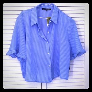 Fashionable blue blouse with white stripes. New.